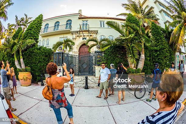 People Visit The Versace Mansion At Ocean Drive Stock Photo - Download Image Now - Camera - Photographic Equipment, Celebrities, Gate