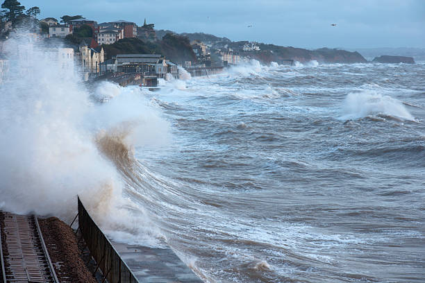 istock Waves breaking over the railway line at Dawlish 472158603