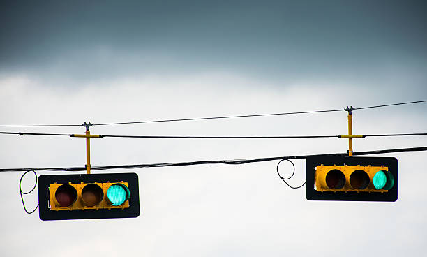istock Green Light hanging over Street Lights 472159676