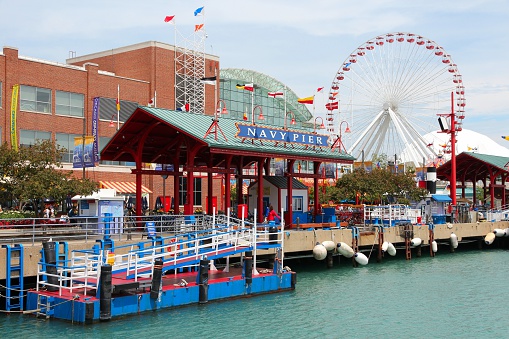 Chicago, United States - June 26, 2013: People visit famous Navy Pier on June 26, 2013 in Chicago. The 3,300-foot pier built in 1916 is one of most recognized Chicago landmarks.