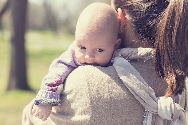 istock Young Woman Mother Hugging Her Baby 472159848