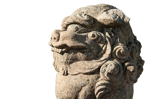 A closeup shot of an oriental stone lion/dragon taken at a temple in Japan