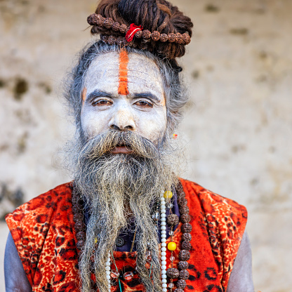 This Sadhu uses ashes of cremated remains to prepare specific white color of his makeup.