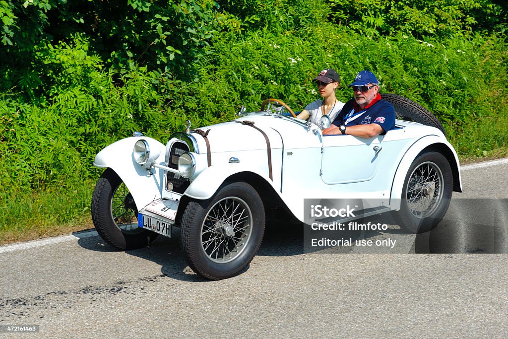 Classic car rally with Aero Landsberg, Germany - July 13, 2013: Every second year an oldtimer rally, named Herkomer-Konkurrenz, is organized for at least 80 years old classic cars in city Landsberg. Ca. 75 veteran cars participate at this event with their drivers, mostly clothed in old fashion style. The route runs on public streets through the rural landscape and small villages of Bavaria. Here you see an Aero 10, built at year 1929, 1929 Stock Photo