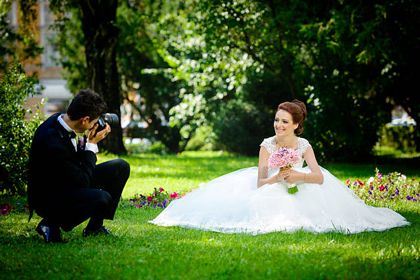 istock groom photographing his bride 472161527