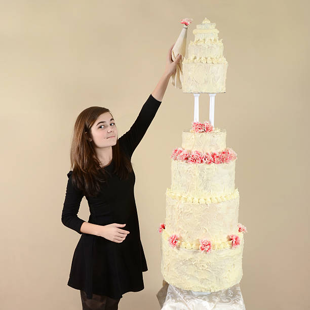 istock Girl With a Very Tall Cake 472162025