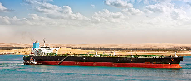 istock Tugboat assisting supertanker 472162026