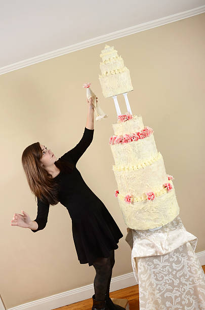 istock Girl With a Very Tall Cake 472162027