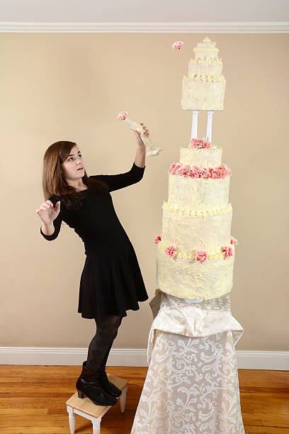 istock Girl With a Very Tall Cake 472162037