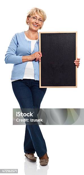 Senior Woman With Blackboard Stock Photo - Download Image Now - Cut Out, Mature Women, Chalkboard - Visual Aid