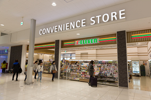 Osaka, Japan - April 13, 2015 : People at 7-Eleven Convenience Store in Kansai International Airport, Osaka, Japan. 7-Eleven is a international chain of convenience stores. 
