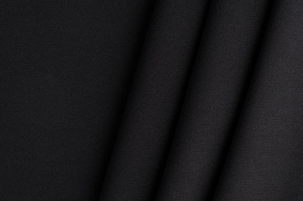 Black cloth with straight folds stock photo