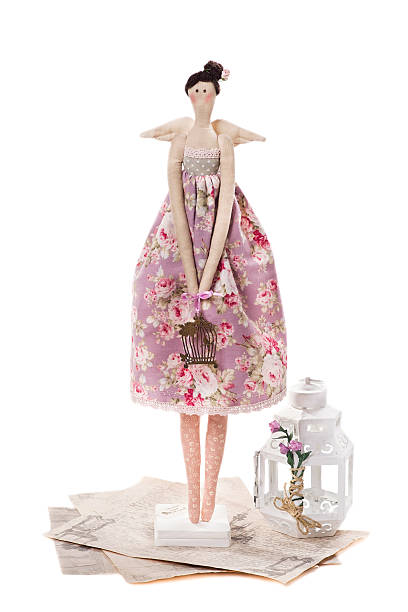 istock Textile doll on a white background, made by hand 472165093