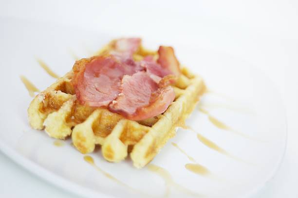 A bacon and maple syrup waffle stock photo