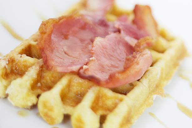 Waffle bacon and maple syrup stock photo