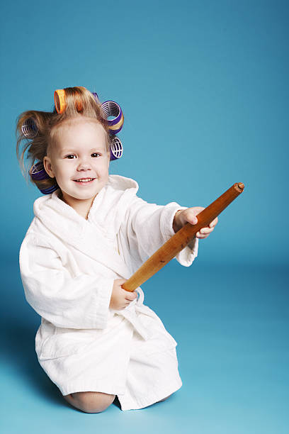 istock young happy housewife with rolling pin 472165941