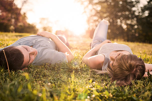 istock Teenage couple at sunset. 472167579
