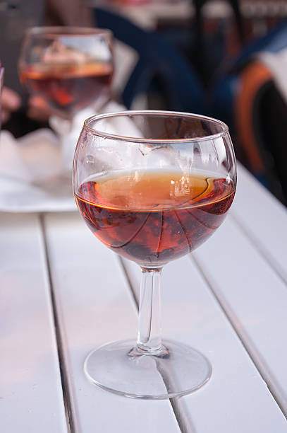 istock Glass of wine on the white table. 472167794