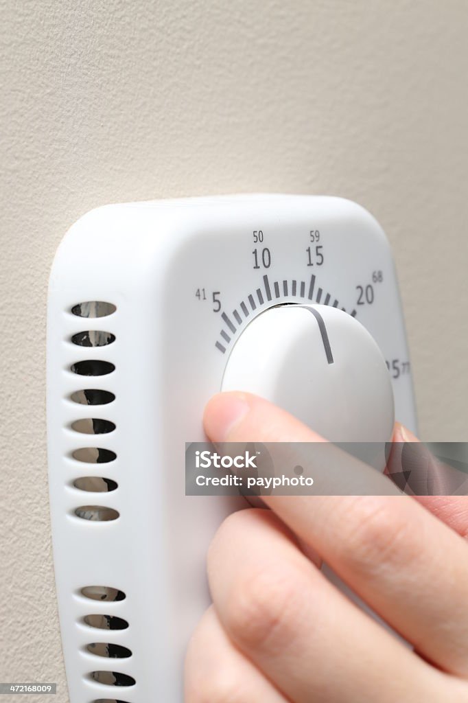 Turning up thermostat Adjusting Stock Photo