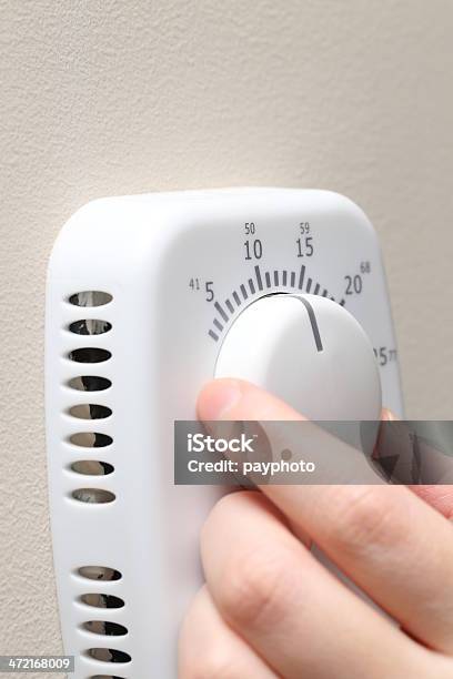 Turning Up Thermostat Stock Photo - Download Image Now - Adjusting, Carbon Footprint, Change