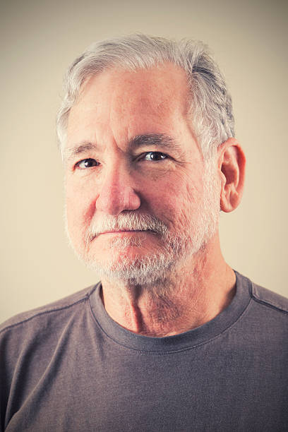 istock Studio shot of senior man with grey hair and beard 472168065