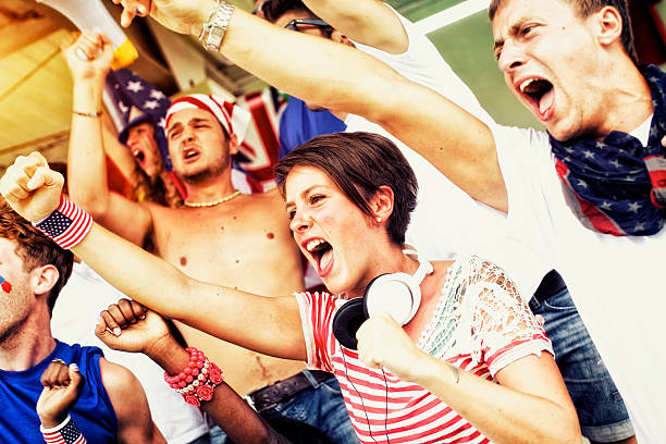 istock Sports fans cheering a game 472170027