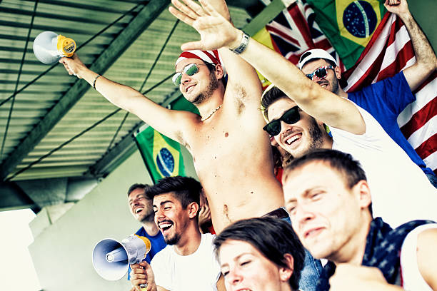 istock Sports fans cheering a game 472170033