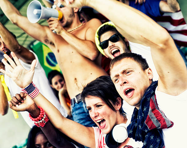 istock Sports fans cheering a game 472170069