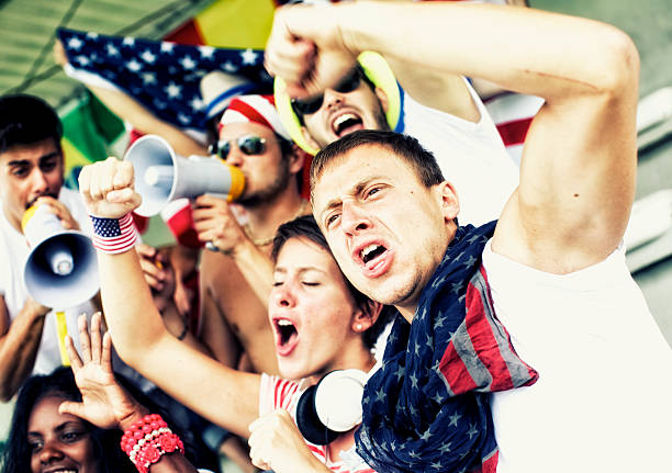 Sports fans cheering a game