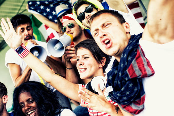 istock Sports fans cheering a game 472170113