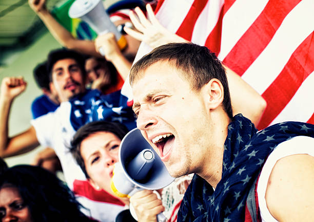 istock Sports fans cheering a game 472170141