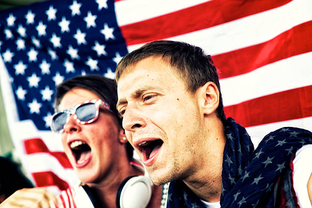 istock Sports fans cheering a game 472170155