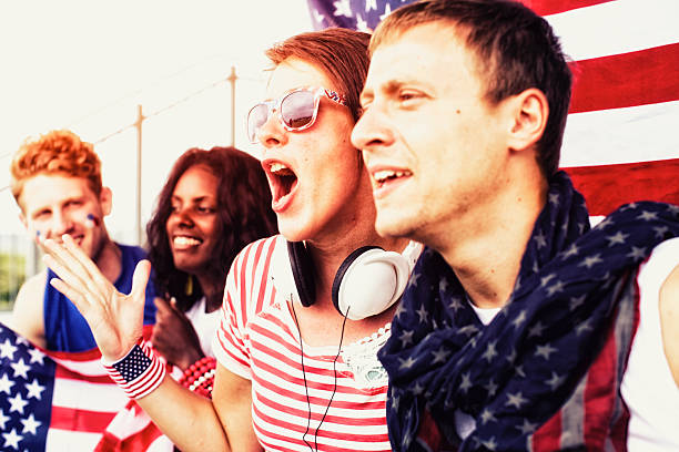istock Sports fans cheering a game 472170163