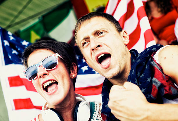 istock Sports fans cheering a game 472170193