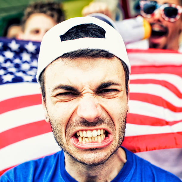 istock Sports fans cheering a game 472170215