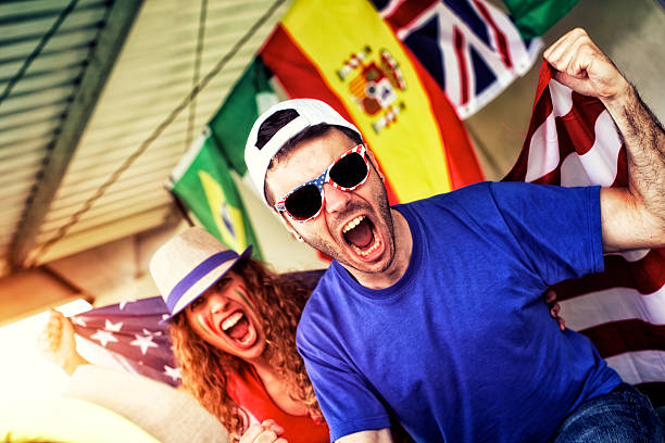 istock Sports fans cheering a game 472170231