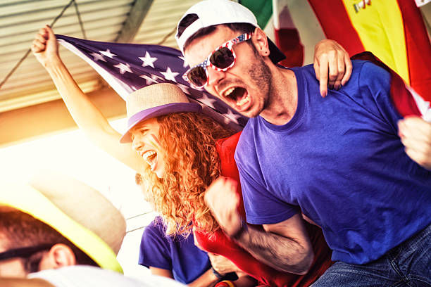 istock Sports fans cheering a game 472170233