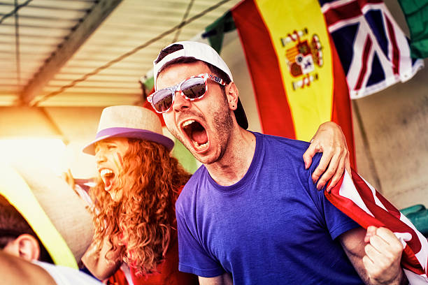 istock Sports fans cheering a game 472170237