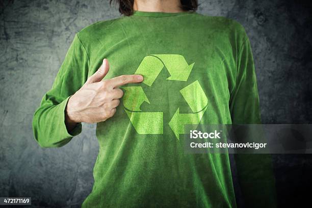 Recycle Man Pointing To Recycling Symbol Printed On His Shirt Stock Photo - Download Image Now