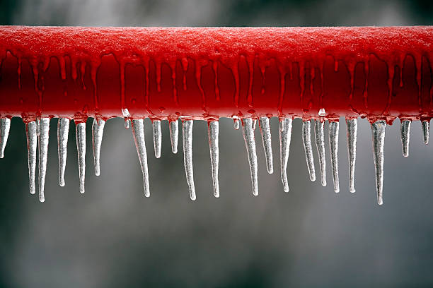 frozen bar red frozen metal bar frozen water stock pictures, royalty-free photos & images