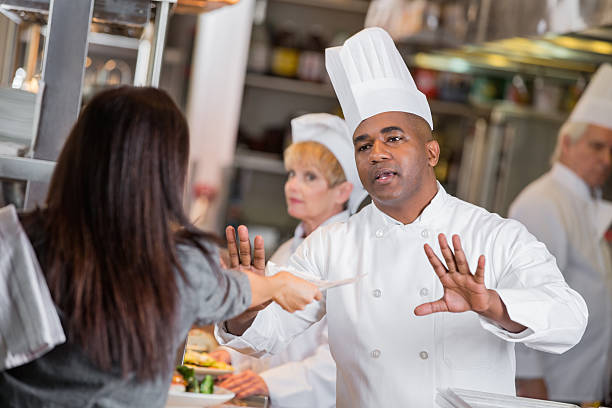 istock Restaurant manager yelling at chefs in kitchen with late tickets 472172491