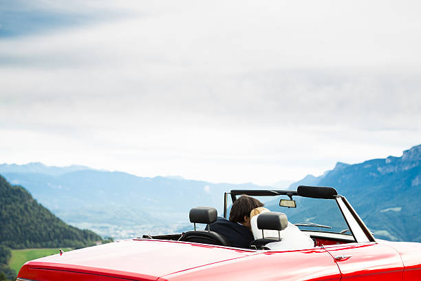 istock Happy wedding couple in a cabriolet 472172619