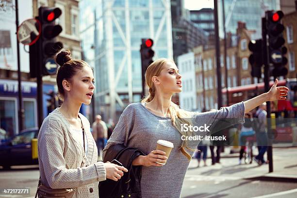 Hailing A Taxi Stock Photo - Download Image Now - 20-24 Years, Adult, Beautiful People