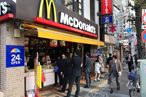 Tokyo, Japan - April 12, 2012:  People visit McDonalds restaurant on April 12, 2012 in Tokyo. McDonald's is the 2nd most successful franchise in the world with 33,000 locations.