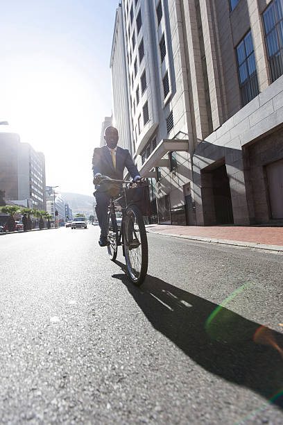 istock African businessman commuting Cape Town on his bicycle. 472173133