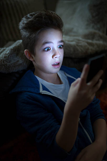 istock Boy shocked by something on his smartphone 472173691