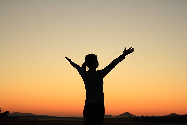 istock Woman at Sunset 472174759