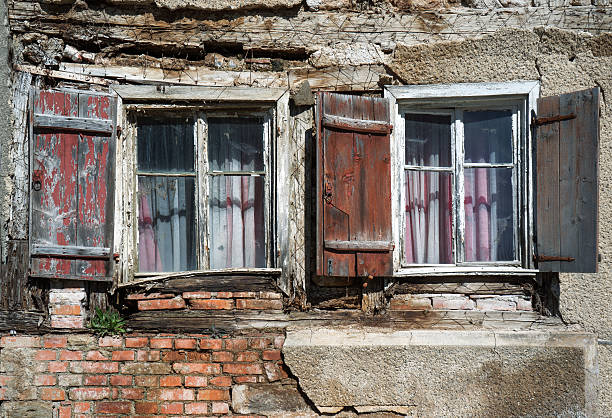 istock Two windows in the ruin of a house 472175910