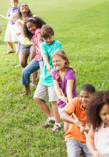 istock Children playing tug of war 472177023