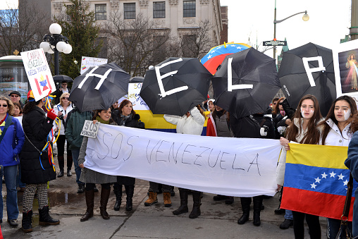 Ottawa, Canada - February 22, 2014: Venezuelans gather in front of Parliament Hill in Ottawa to bring attention to the plight of their countrymen who are protesting against the Venezuelan government. Recently protesters in Venezuela have been killed and the Venezuelan government has been censoring the media.